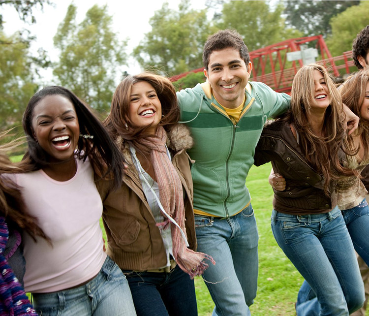 group of diverse, smiling teens